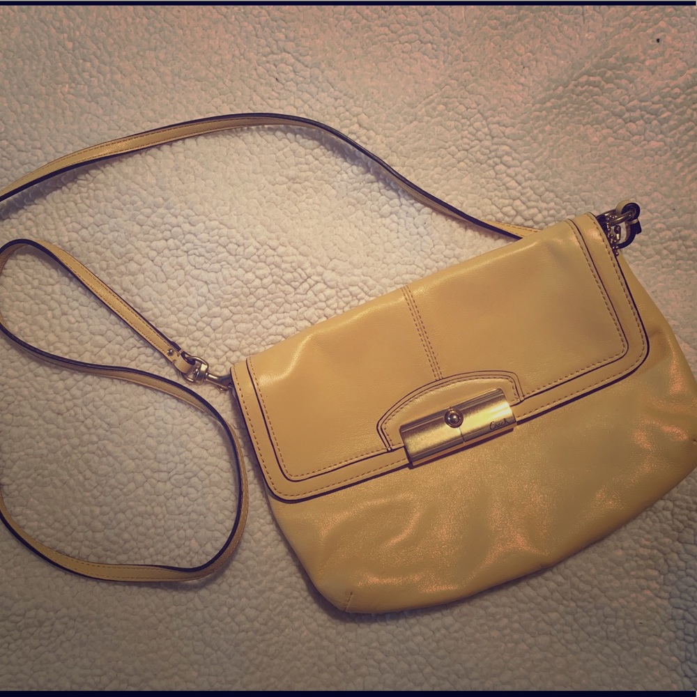 Pale yellow Coach crossbody